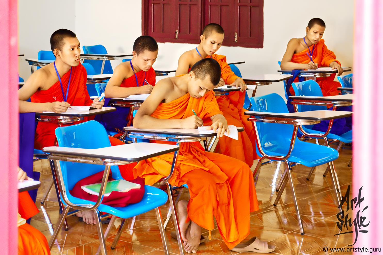 Monks having their lesson at Sangha school, Wat Ong Teu Mahawihan (Temple of the Heavy Buddha), Vientiane, Laos.