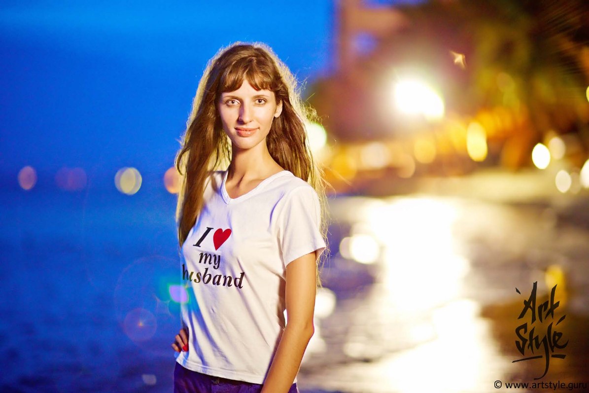 A bright, mood-preserving portrait shot in the same low light.