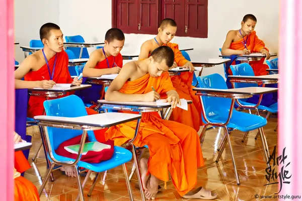 Monks having their lesson at Sangha school, Wat Ong Teu Mahawihan (Temple of the Heavy Buddha), Vientiane, Laos.